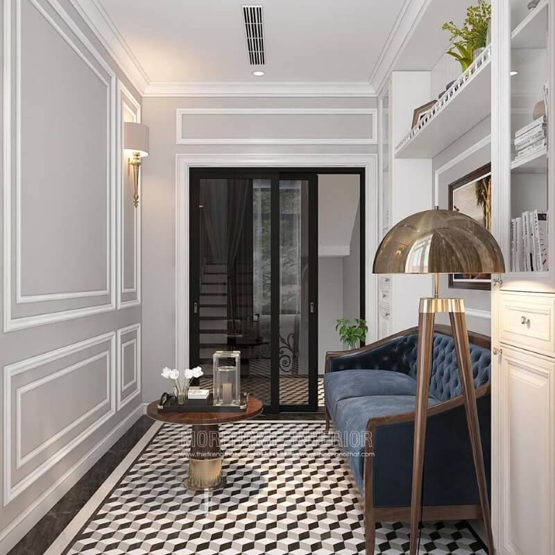 Gạch lát nền giả cổ, sofa đơn gỗ óc chó tân cổ điển bọc nệm xanh cùng tường trắng đơn sắc đã tạo nên không gian đẹp sang trọng, đáp ứng tối đa công năng cho phòng đọc sách. Mẫu nội thất biệt thự tân cổ điển đẹp