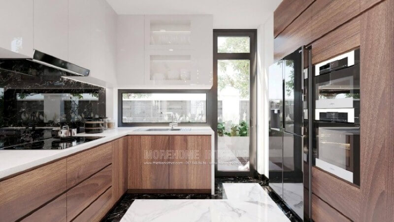 Nếu bạn đã được xem các mẫu tủ bếp hiện đại có tay nắm, thì có thể những mẫu tủ bếp đó đã lỗi thời, thiết kế phòng bếp với toàn bộ bề mặt cánh tủ trơn nhẵn là một sự đổi mới hoàn hảo, không chút tay cầm nhưng lại kéo đẩy dễ dàng nhờ ý tưởng thiết kế vát từ cánh tủ giúp bề mặt gọn gàng mà đẹp mắt. Thiết kế và sản xuất tủ bếp đẹp